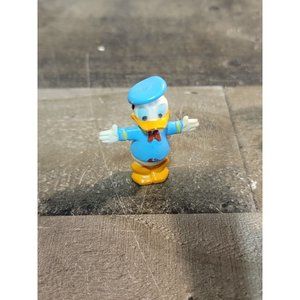 Walt Disney production Donald duck hands out toy figure